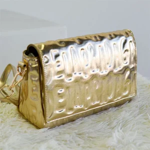 Agatha Ruiz de la Prada Bolso bandolera metalizado oro con solapa